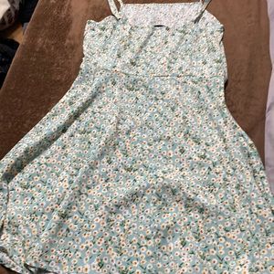 Light pastel green spaghetti strap dress with white flowers